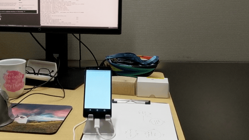 An early version of Developer Quest being exercised by Flutter Driver on my desk.